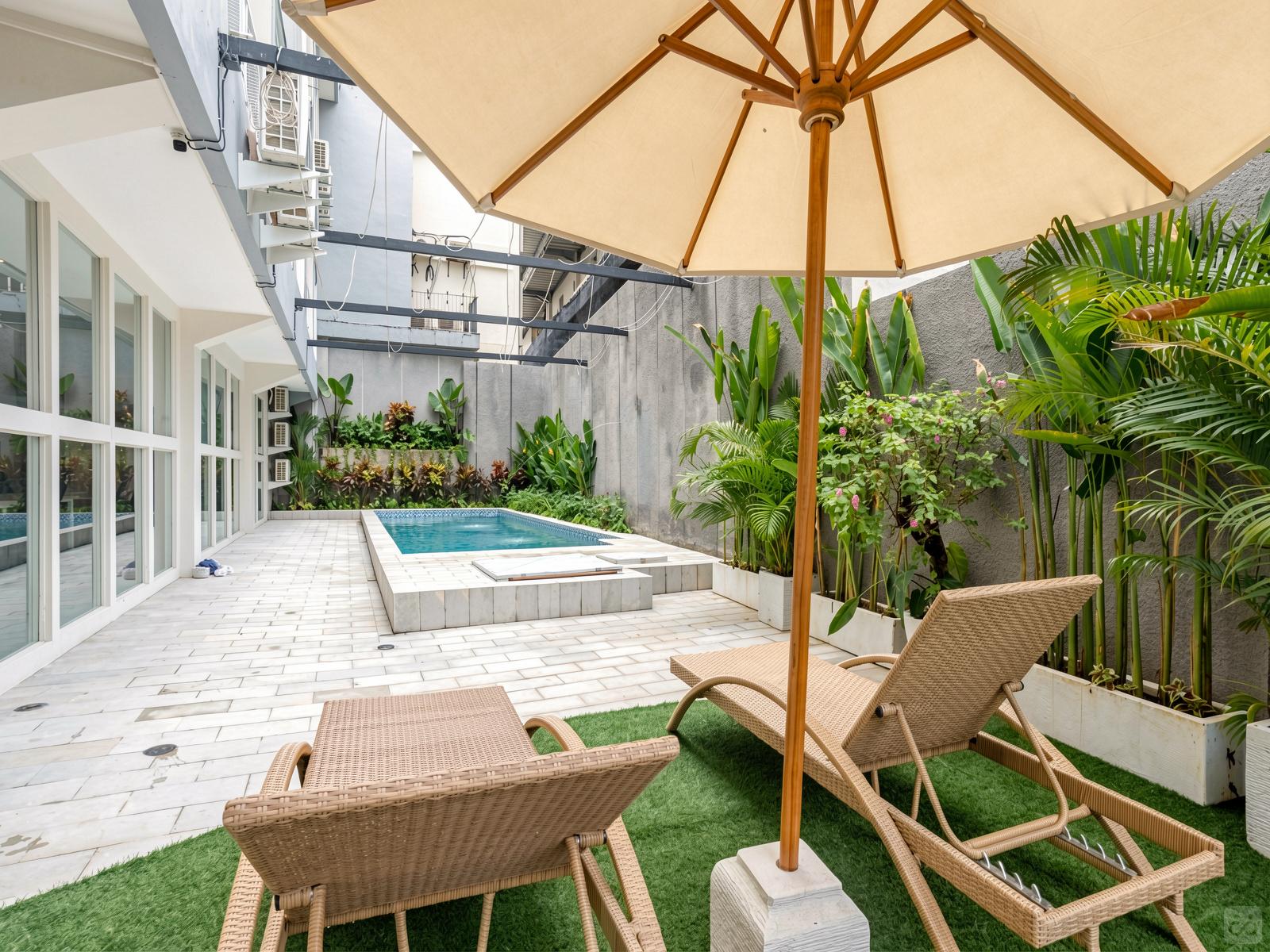 El Elegante comunidad tropical con espacio de trabajo y piscina compartidos Colectivo